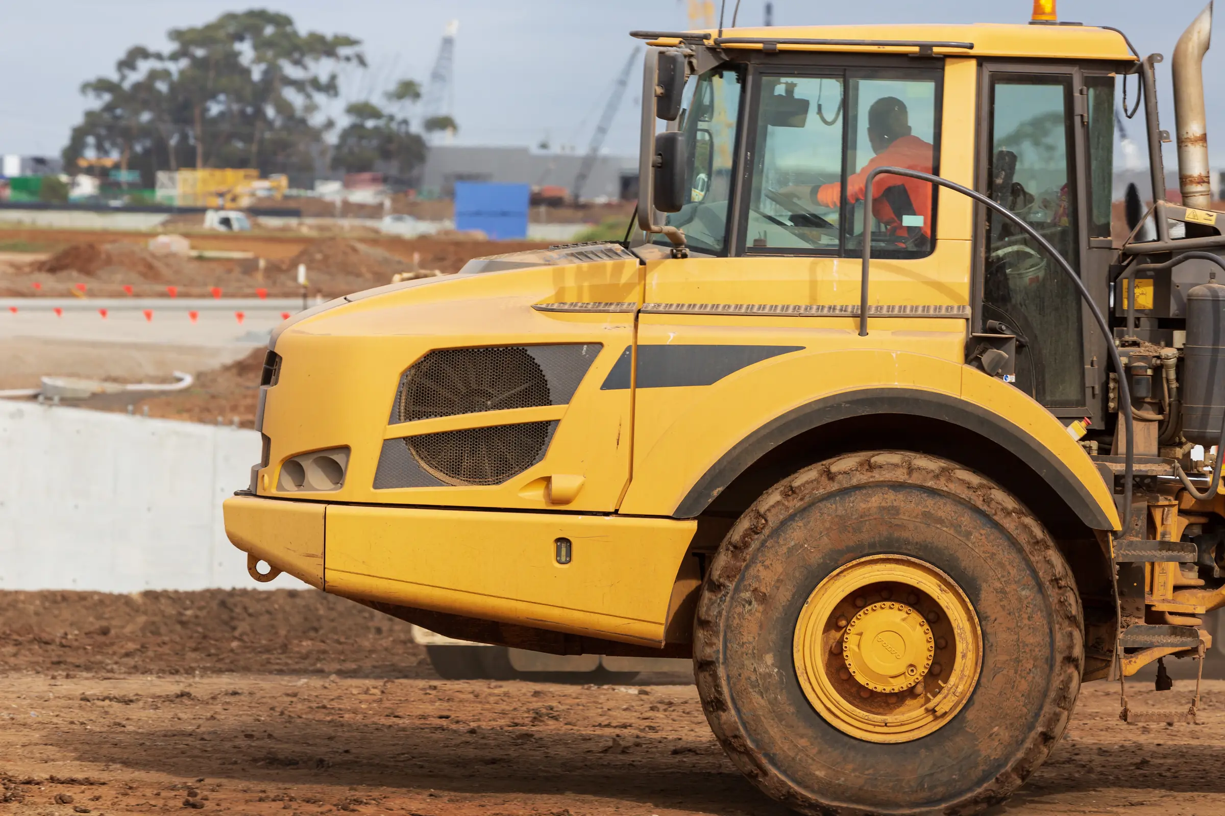 Large mining dump truck operating on an unsealed dirt road